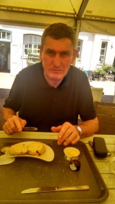 Believe it or not, Philip is happy with his scones, jam and cream.